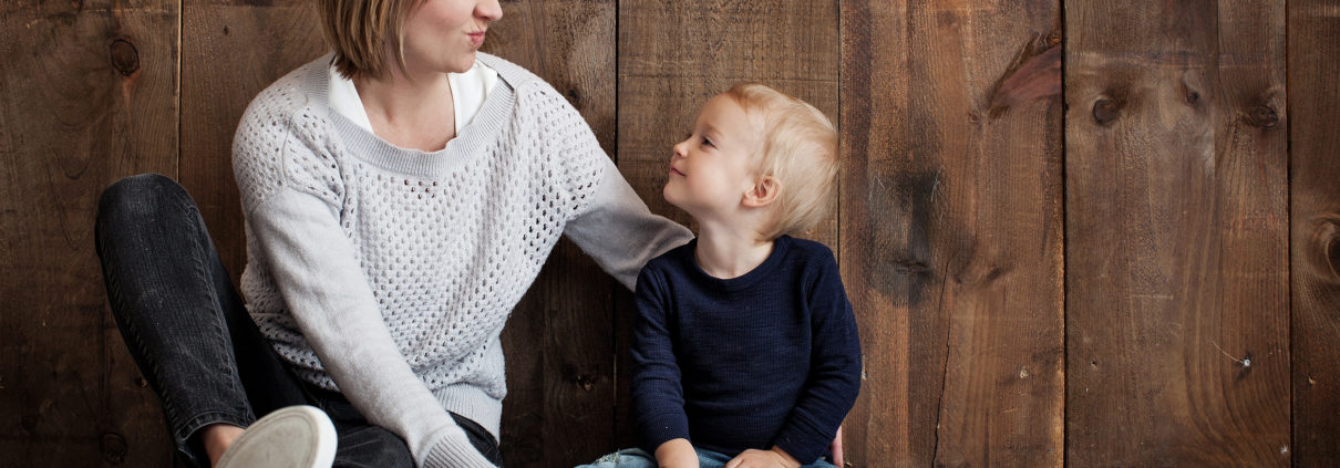 What is Positive Parenting? photo of a young boy in his mother's lap